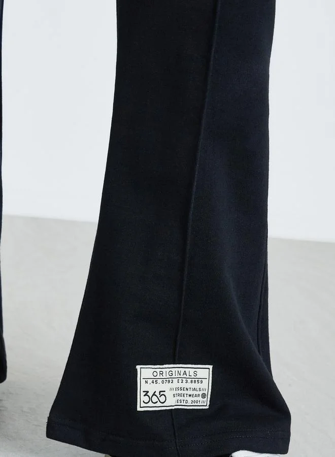 Styli Women Black  Black Wide Leg Joggers with Badge Detail